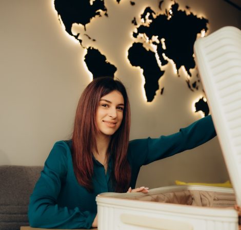a woman with a suitcase in a travel agency