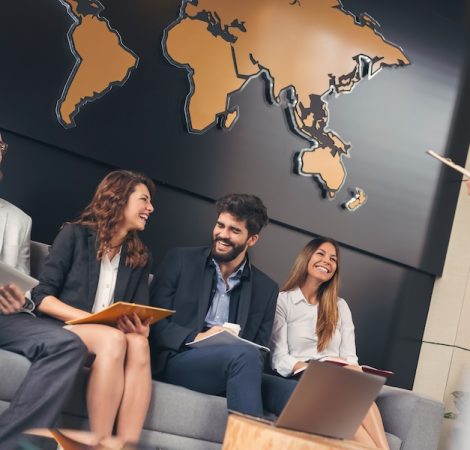 Business people waiting for a job interview in a modern office building. Focus on the man and the woman on the right